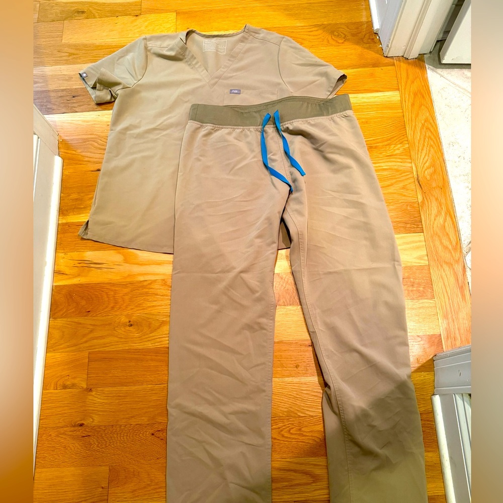 Figs tan colored set- size large- used very good condition.